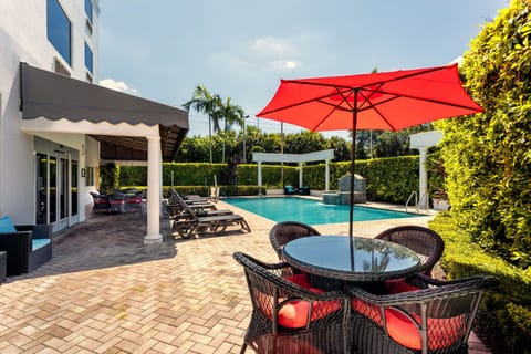 Outdoor pool, open 7 AM to 10 PM, sun loungers