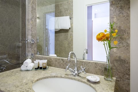 Family Quadruple Room, Multiple Beds | Bathroom | Combined shower/tub, designer toiletries, hair dryer, bathrobes