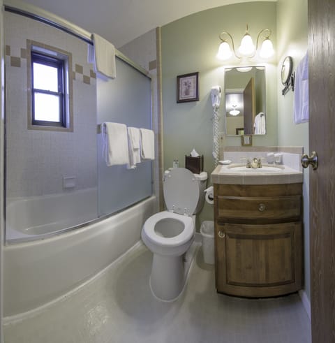 Superior Suite, 1 King Bed, Kitchenette | Bathroom | Combined shower/tub, free toiletries, hair dryer, towels