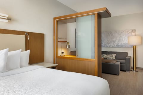 Hypo-allergenic bedding, desk, laptop workspace, blackout drapes