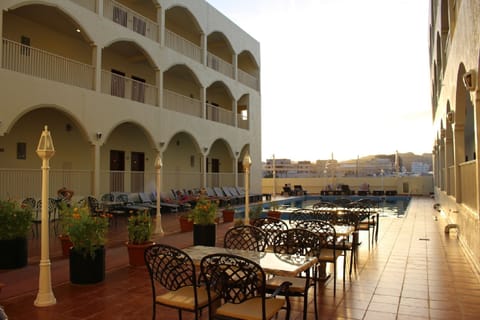 Outdoor pool, open 8 AM to 9 PM, sun loungers
