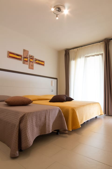 Superior Triple Room | Minibar, in-room safe, desk, free cribs/infant beds