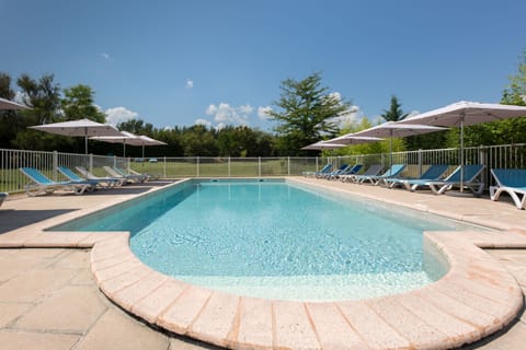 Seasonal outdoor pool, open 7:00 AM to 10:00 PM, pool umbrellas