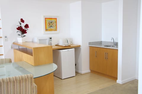 Suite, 1 King Bed, Partial Sea View | Minibar, in-room safe, blackout drapes, soundproofing