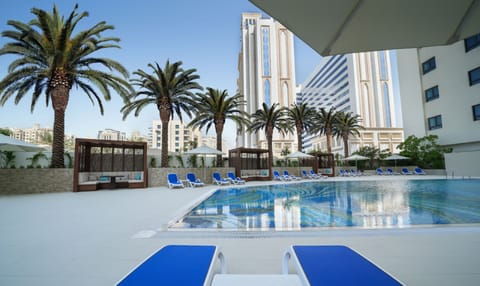 Outdoor pool, open 7:00 AM to 8:00 PM, free cabanas, pool umbrellas