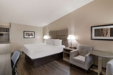 Desk, laptop workspace, blackout drapes, iron/ironing board