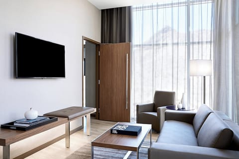Suite, 1 Bedroom, Balcony (Corner) | Living area | 55-inch Smart TV with cable channels, TV, Netflix