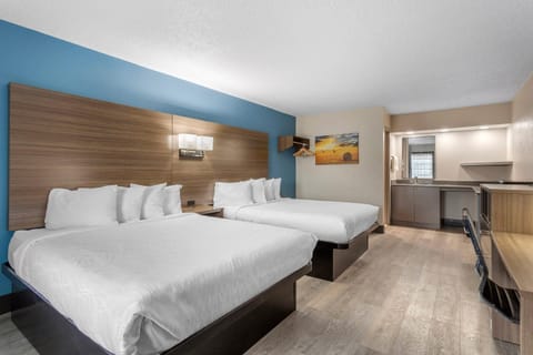 Room, 2 Queen Beds, Non Smoking, Pool View | Desk, laptop workspace, blackout drapes, iron/ironing board