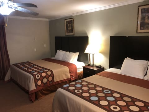 Hypo-allergenic bedding, desk, laptop workspace, blackout drapes