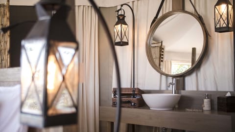 One Bedroom Cliff Tent Villa | Minibar, in-room safe, desk, laptop workspace