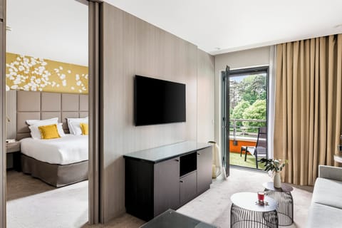 Suite, 1 Queen Bed, Balcony | In-room safe, desk, blackout drapes, soundproofing