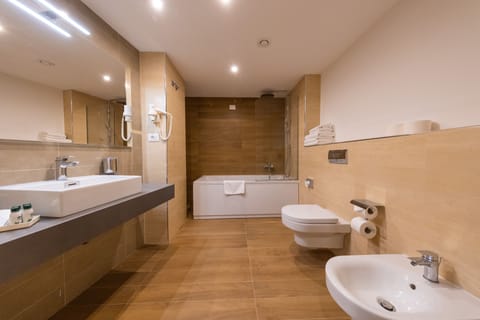 Family Room, Balcony, Park View | Bathroom | Hydromassage showerhead, designer toiletries, hair dryer, towels