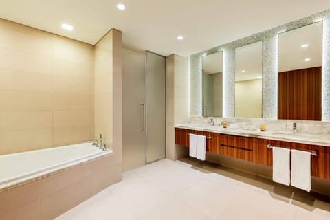 Suite, 1 King Bed, Smoking | Bathroom | Separate tub and shower, designer toiletries, hair dryer, bathrobes