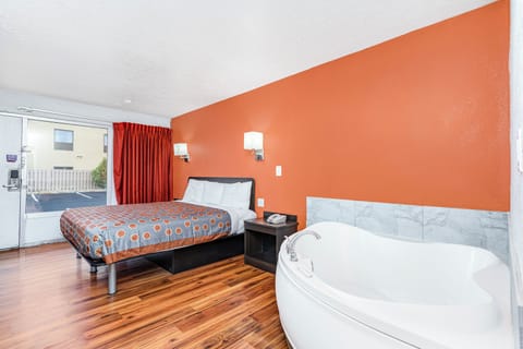 Room, 1 King Bed, Non Smoking, Jetted Tub | Desk, iron/ironing board, free WiFi, bed sheets