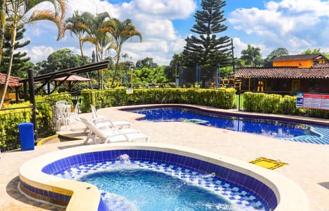 Outdoor pool, open 9:00 AM to 10:00 PM, sun loungers