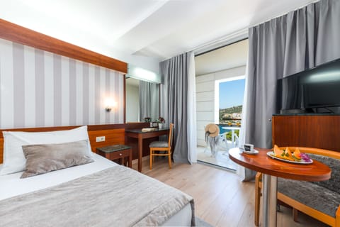 Standard Double or Twin Room, Balcony, Sea View | Minibar, in-room safe, desk, blackout drapes