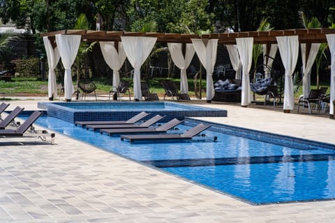 Indoor pool, outdoor pool, open 8:00 AM to 10:00 PM, sun loungers