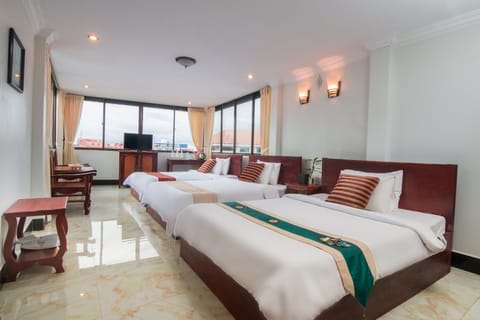Superior Triple Room, City View | Minibar, desk, iron/ironing board, rollaway beds