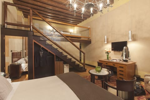 Quadruple Room | Minibar, in-room safe, individually decorated, individually furnished