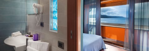 Deluxe Double or Twin Room, Sea View | Minibar, in-room safe, desk, free WiFi