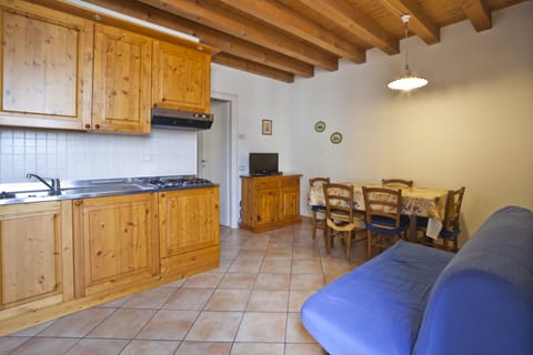 Family Apartment, 1 Bedroom, Refrigerator & Microwave | Living room | LCD TV