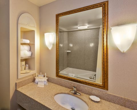 Suite, 1 King Bed, Jetted Tub (Whirlpool) | Bathroom | Combined shower/tub, hair dryer, towels