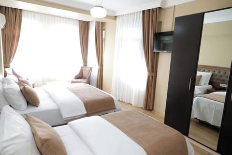Family Triple Room | Premium bedding, free minibar, in-room safe, soundproofing