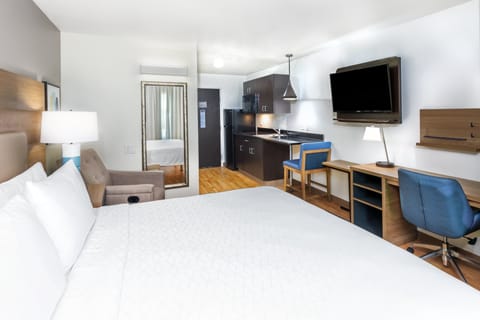 Desk, laptop workspace, blackout drapes, iron/ironing board