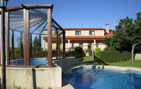 Outdoor pool, a waterfall pool, sun loungers