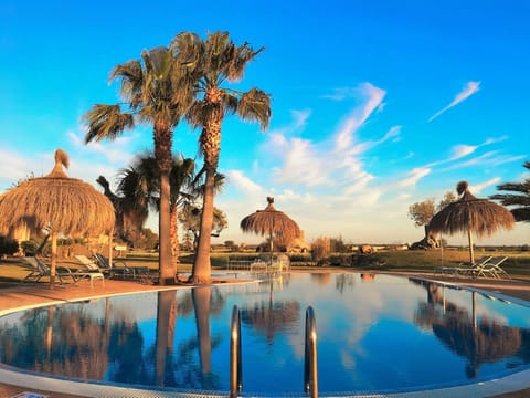 Indoor pool, outdoor pool, pool umbrellas, sun loungers