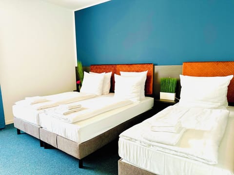 Triple Room | Hypo-allergenic bedding, minibar, desk, laptop workspace