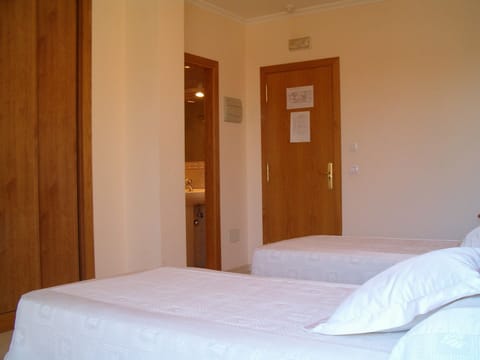 Double or Twin Room | Desk, blackout drapes, iron/ironing board, rollaway beds