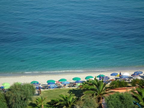 Private beach, white sand, sun loungers, beach umbrellas