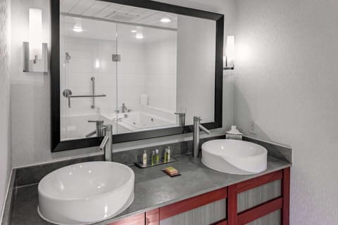 Premium bedding, desk, laptop workspace, iron/ironing board