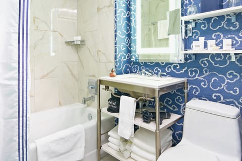 Combined shower/tub, hair dryer, towels, soap