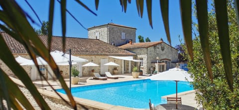 Outdoor pool, a heated pool, open open 24 hours, pool umbrellas