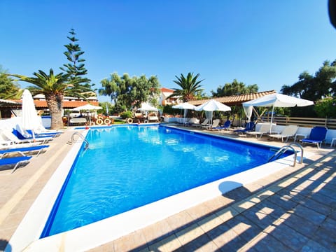 Outdoor pool, pool umbrellas, sun loungers