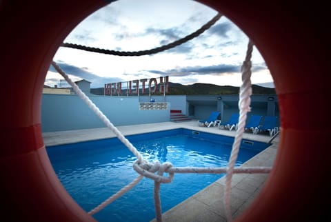 Seasonal outdoor pool, open 10:00 AM to 9:00 PM, sun loungers