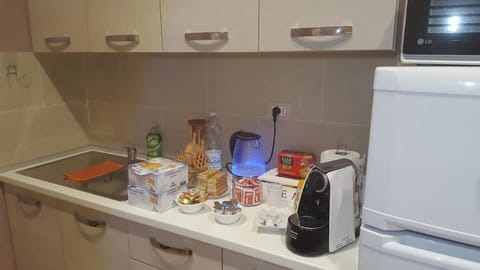 Fridge, electric kettle, cookware/dishes/utensils