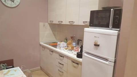Fridge, electric kettle, cookware/dishes/utensils