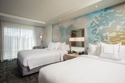 Premium bedding, desk, laptop workspace, blackout drapes