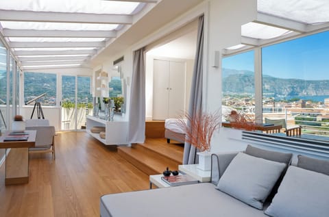 Executive Suite, Terrace, Sea View | Minibar, in-room safe, desk, blackout drapes