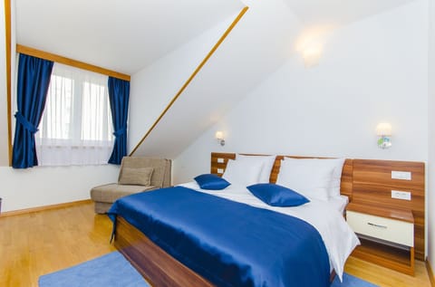 Family Room, City View | Tempur-Pedic beds, minibar, in-room safe, desk