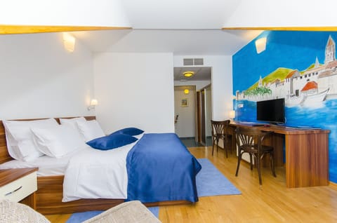 Family Room, City View | Tempur-Pedic beds, minibar, in-room safe, desk