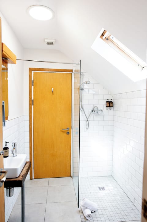 Family Room, 2 Double Beds | Bathroom | Shower, free toiletries, towels