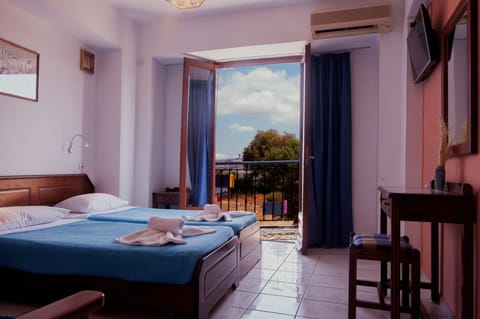 Triple Room, Sea View | In-room safe, desk, laptop workspace, iron/ironing board