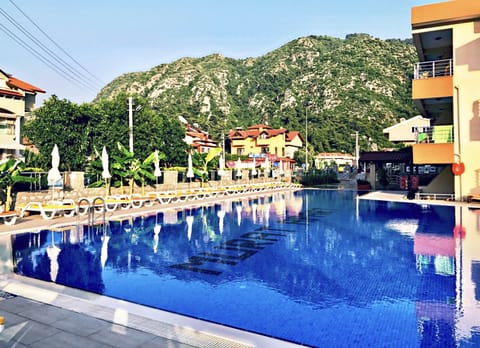 Outdoor pool, pool umbrellas, sun loungers