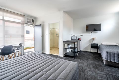 Medium Family Room | Desk, blackout drapes, iron/ironing board, free WiFi