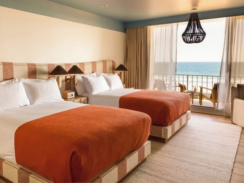 Oceanfront Double Queen with Balcony | Premium bedding, pillowtop beds, minibar, in-room safe