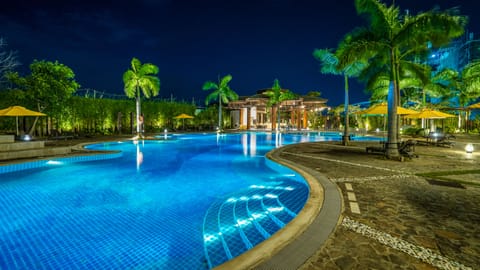 Outdoor pool, pool umbrellas, lifeguards on site